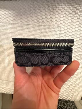Coach Black Signature Small travel pill case. Canvas and patent leather trim.
